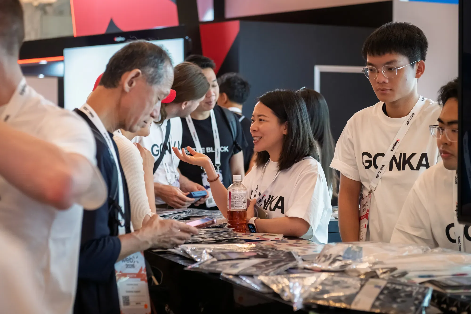 Gonka team speaking with WebX visitors